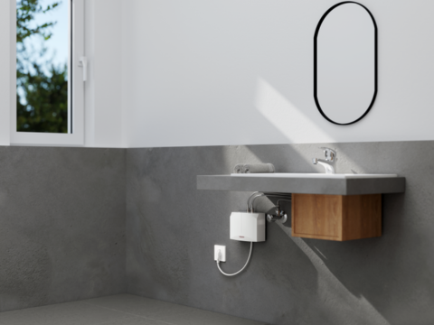 瞬間式電気温水器の省エネ・コスト削減の仕組みを解説：洗面台の下に設置された製品の様子